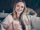 Woman cozy at home with essentials